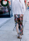 Back view of slit on a maxi with a silky deep sage fabric, warm floral and a hidden back zip.