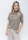 Model wearing tan bottoms and an ultra soft grey tee with a round neck and short sleeves. 