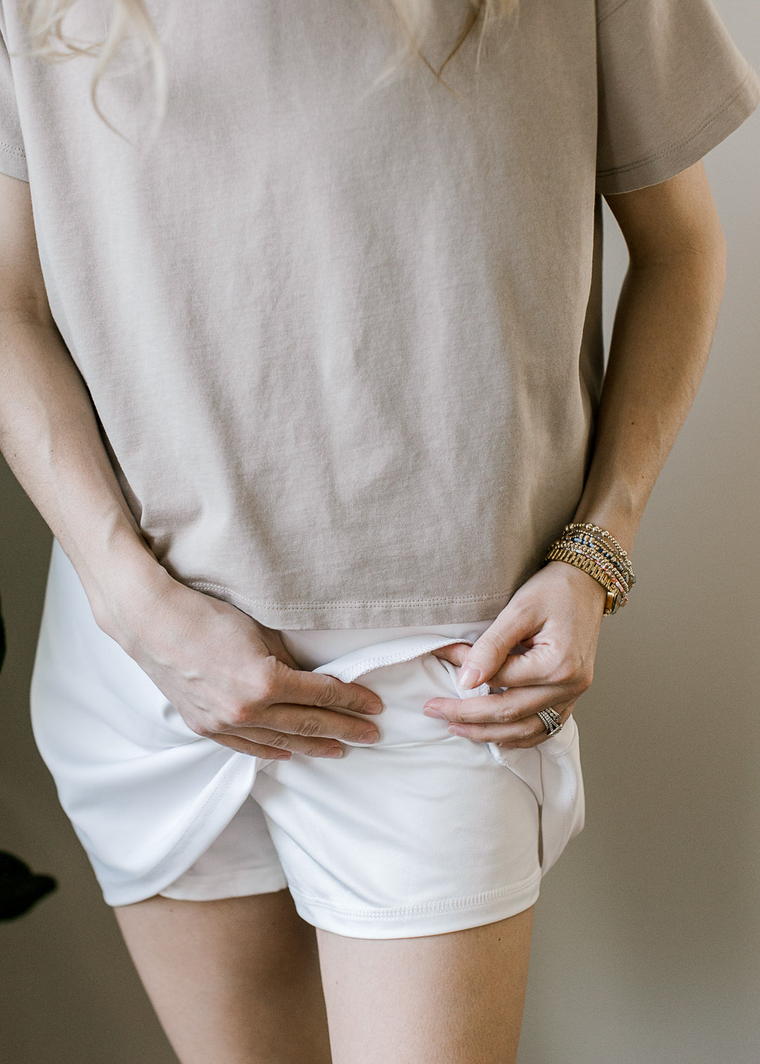 Close up of built in shorts on a white skort with an elastic waist with tie and pockets. 