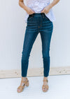 Model wearing medium wash Judy Blue skinny jeans that are high wasted with an elastic waistband. 