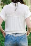 Back view of brunette model wearing 2 toned Judy blue shorts.