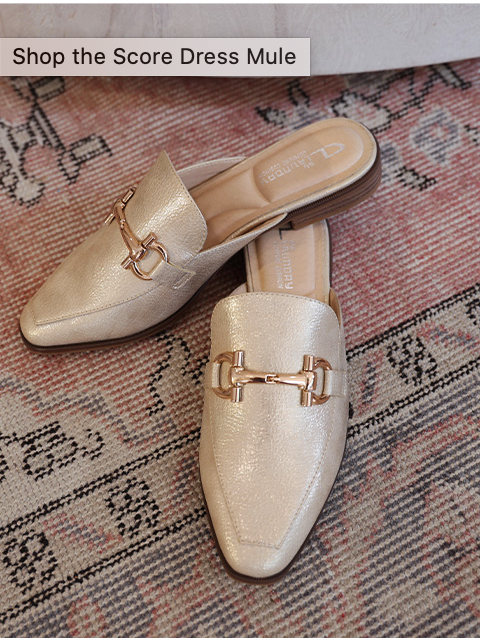 Top view of pair of gold mules with gold buckle