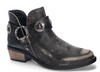 Black bootie with low stacked heel, decorative straps and o-ring accents