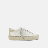 Side view of bone colored shoes with silver strings, a round toe and a star on the side.