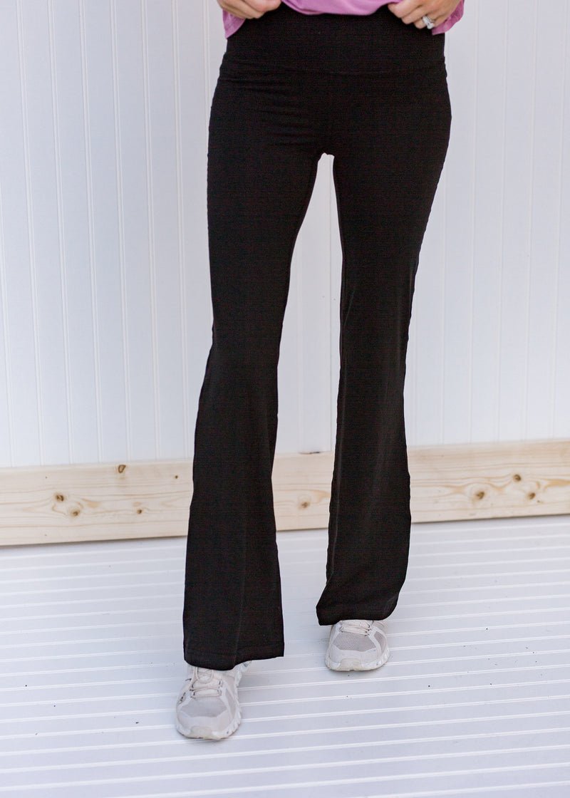 Front view of  black flared yoga pants 