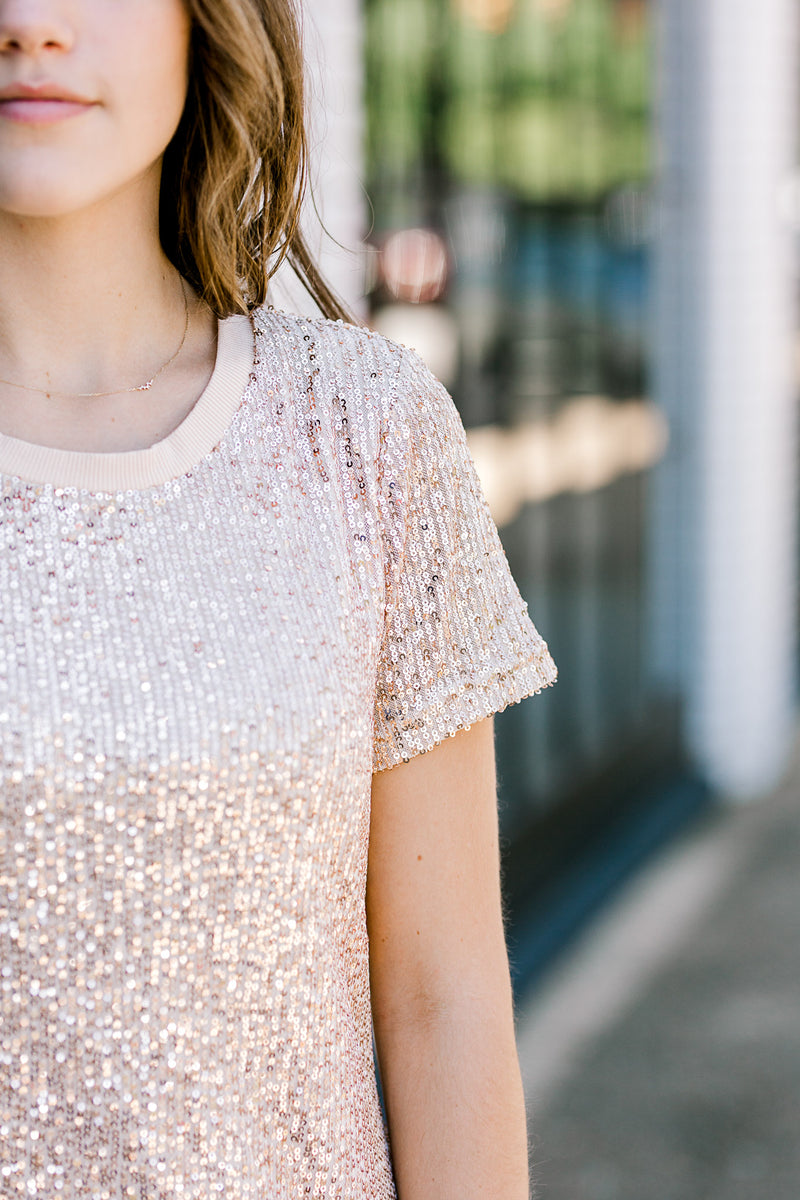 Close up view of sleeve on sequin dress.