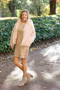 Blonde model wearing champagne colored sequin dress.