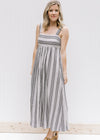 Model wearing black and white midi dress with 2 inch straps.