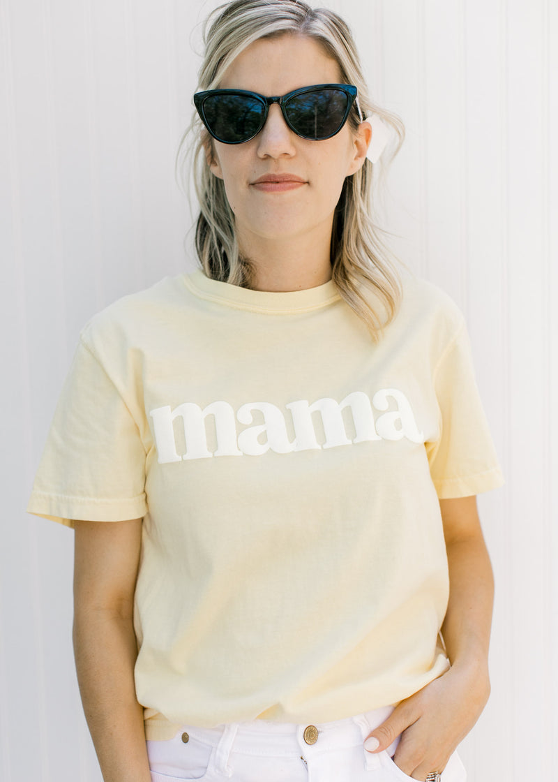 Model wearing all black sunglasses with a black vintage frame. 