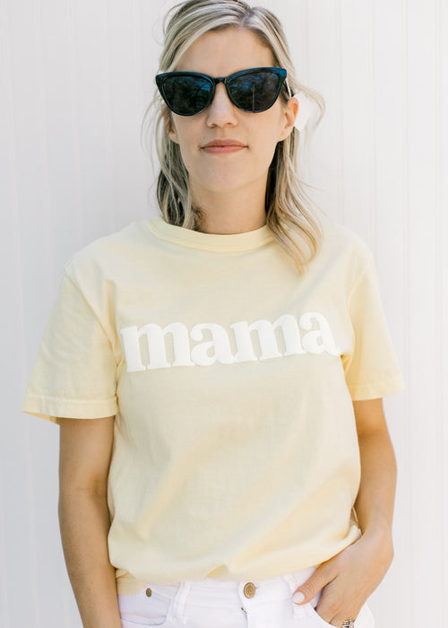 Model wearing all black sunglasses with a black vintage frame. 