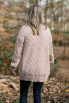 Back view of Blonde model wearing cream open weave cardigan. 