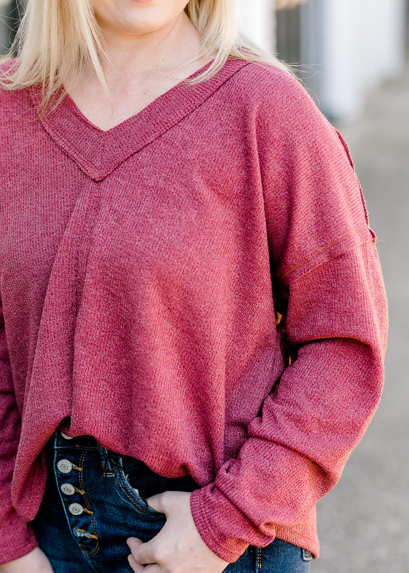  Close up view of Blonde model wearing mauve sweater.