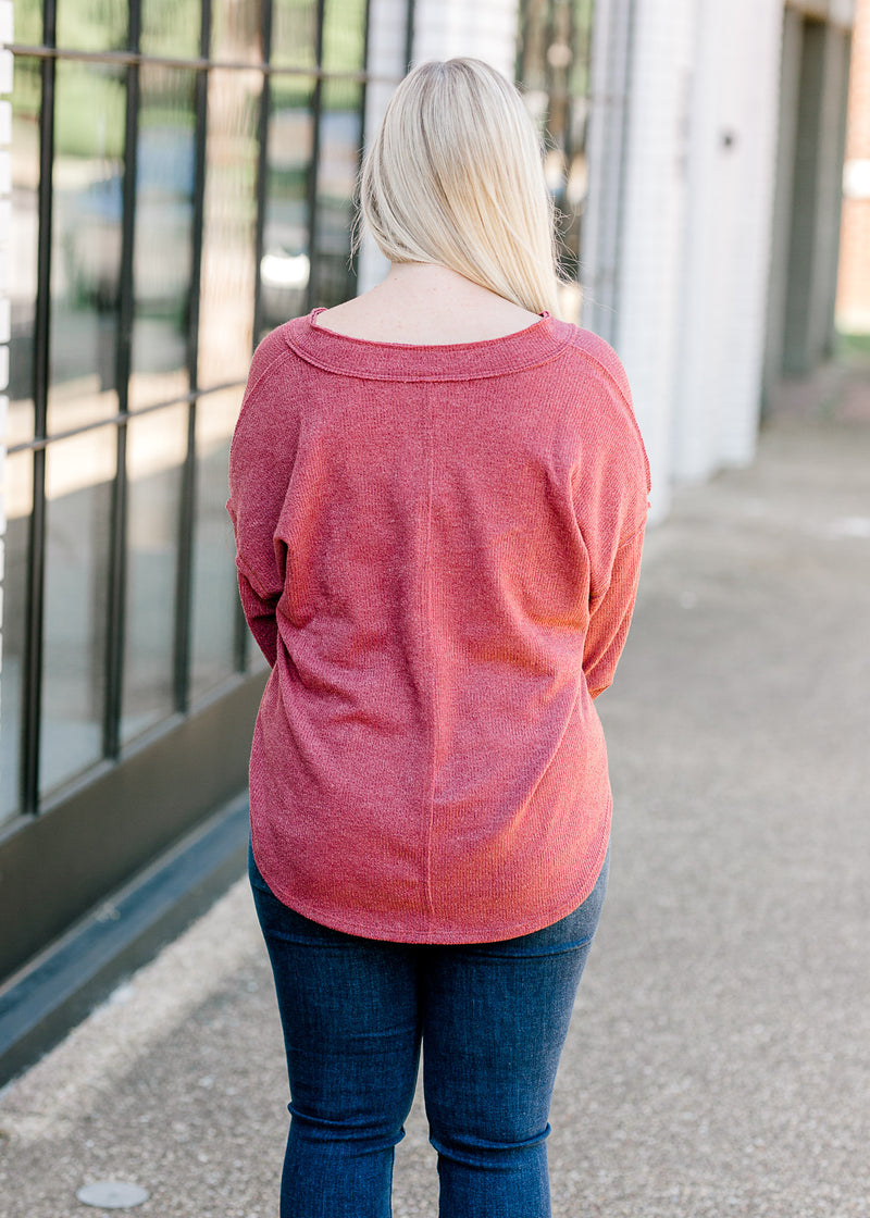 Back view of Blonde model wearing mauve sweater.