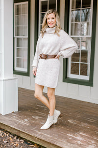 Blonde model wearing ivory sweater dress.