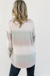 Back view of Blonde model wearing an ombré long sleeve sweater. 