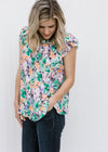 Blonde model wearing a abstract floral top. 