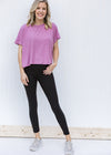Blonde Model wearing full length black leggings.