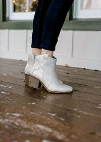 Model wearing natural shimmer bootie.