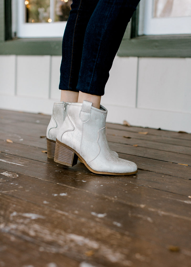 Model wearing natural shimmer bootie.